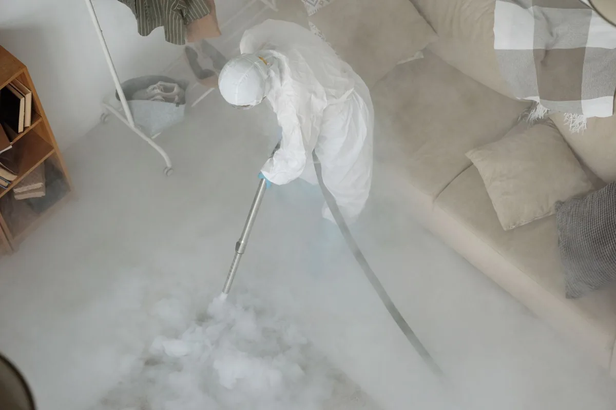 Biohazard cleanup technician in protective equipment, Bellerose Terrace, NY